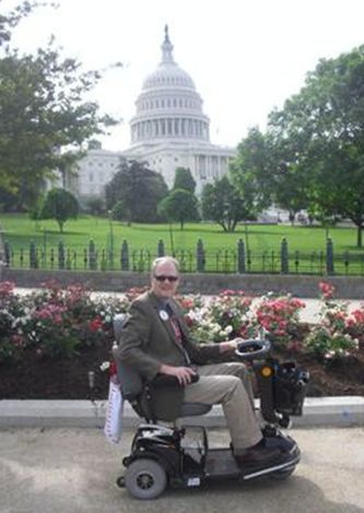 ALS member Persevering in front of the US Capitol, where he was participating in ALS Advocacy Day 2011.